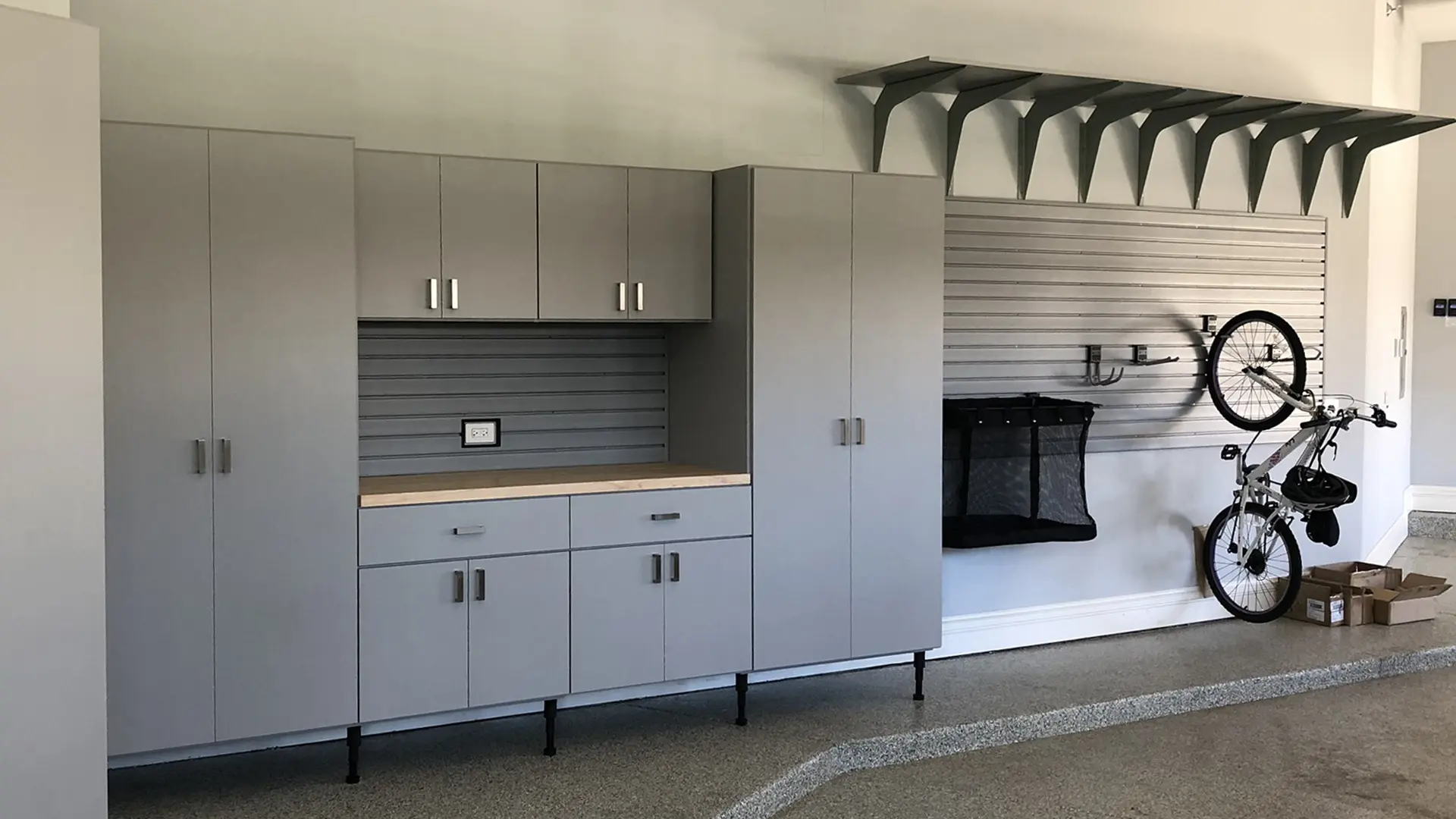 A garage with cabinets and a fireplace in it