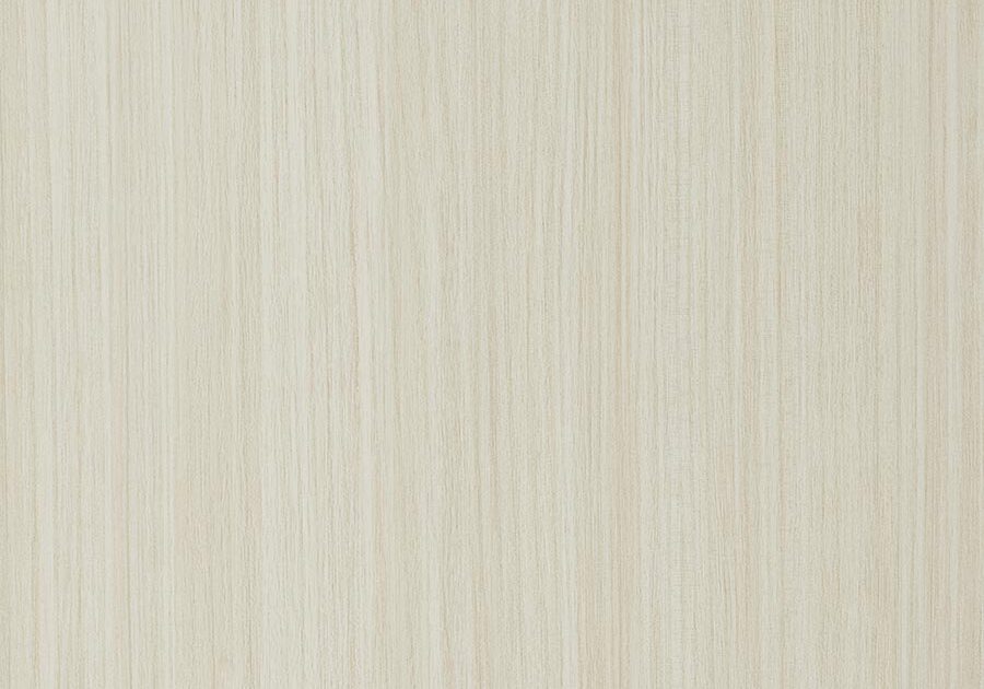 A white wall with some type of wood grain.